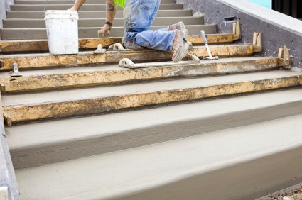 Alpine Roofing & Masonry LLC mason building cement steps in Newtown, PA.